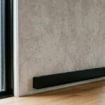 A electric baseboard heater installed in a living room showing clean electric baseboard heaters properly for better efficiency and home safety.