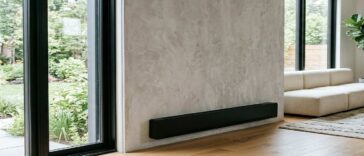 A electric baseboard heater installed in a living room showing clean electric baseboard heaters properly for better efficiency and home safety.