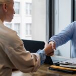 Professionals discussing contract for gratuity in UAE