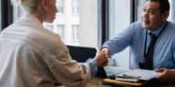 Professionals discussing contract for gratuity in UAE