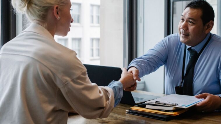Professionals discussing contract for gratuity in UAE
