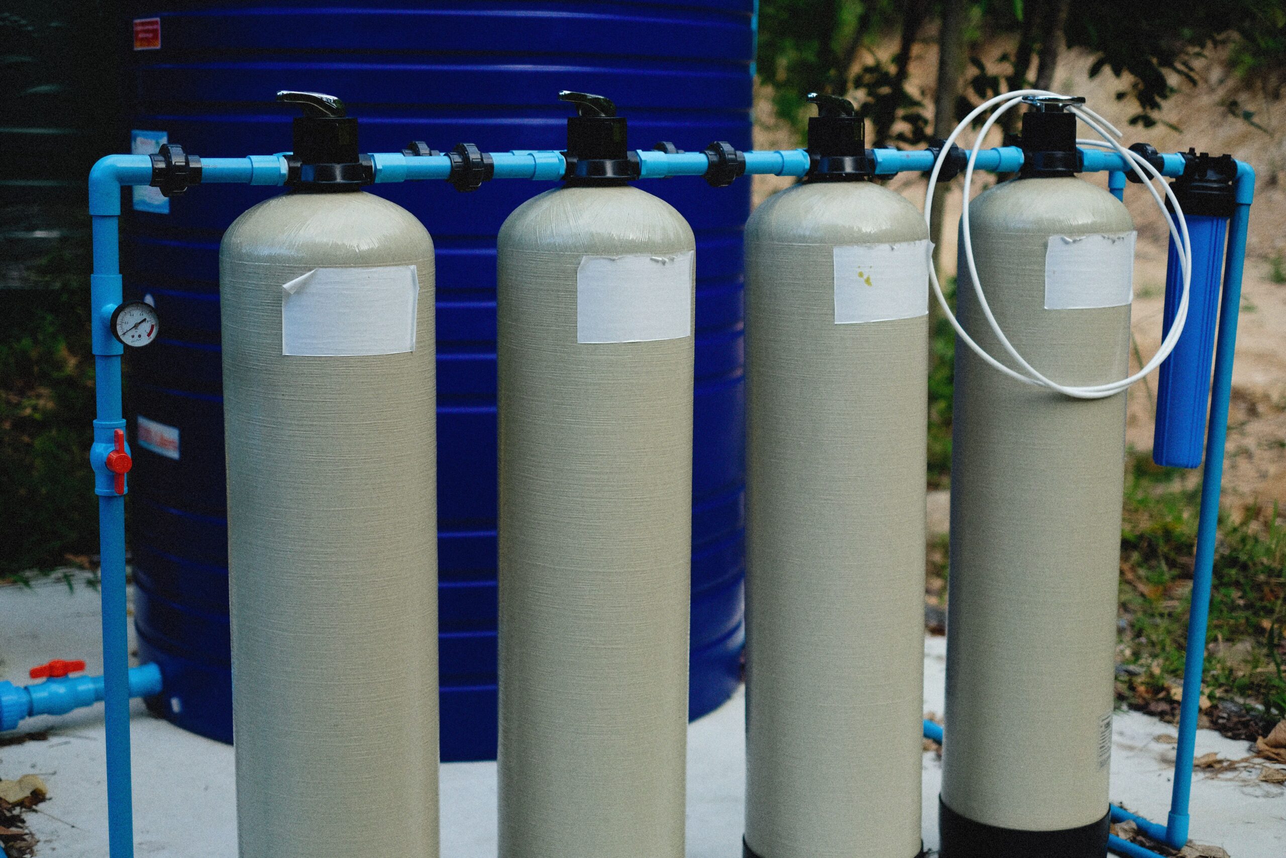 Whole-house water softener and filtration system installed in a home utility room