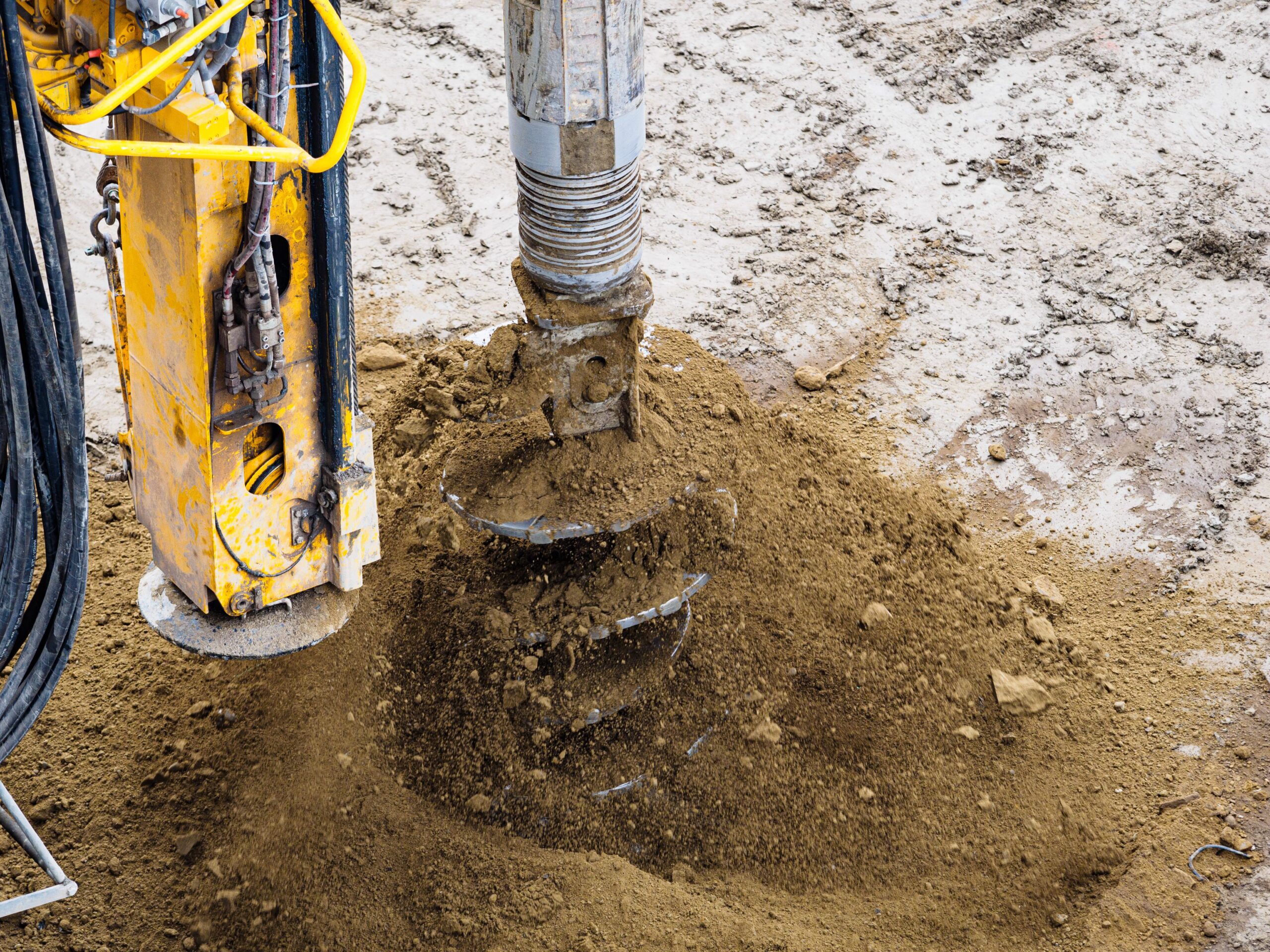 Drill pipe and bit boring into the ground during well construction