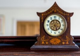Antique wooden mantle clock showing how to wind a clock