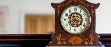 Antique wooden mantle clock showing how to wind a clock