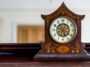 Antique wooden mantle clock showing how to wind a clock