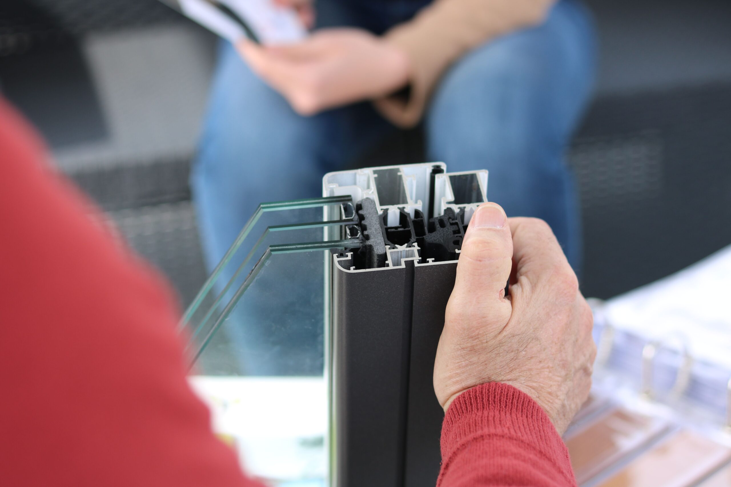 Close-up of aluminum channel profile holding glass panels