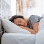 when can i sleep on my side after tooth extraction