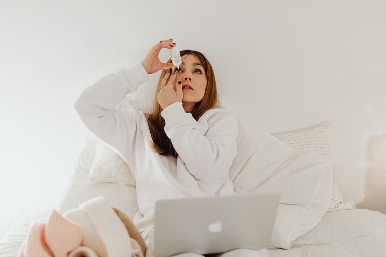 Person putting hydrating drops in eye