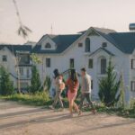 Modern neighborhood representing j society with connected homes and green spaces.