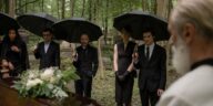 guests attending an outdoor afternoon funeral