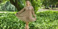 Woman wearing a floral Uncle Frank dress.