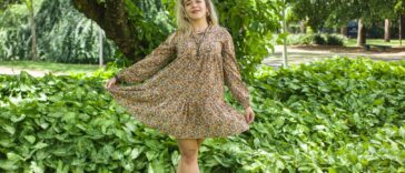Woman wearing a floral Uncle Frank dress.