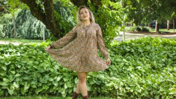 Woman wearing a floral Uncle Frank dress.