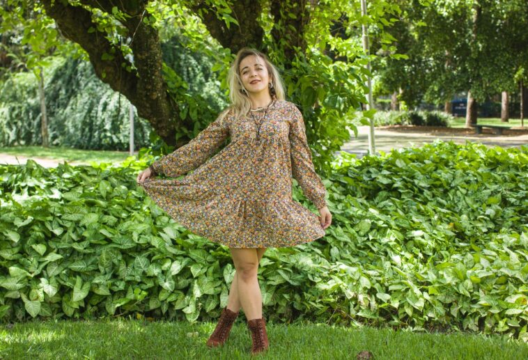 Woman wearing a floral Uncle Frank dress.
