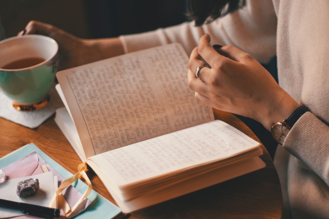writing in a notebook before bed as part of a bedtime routine