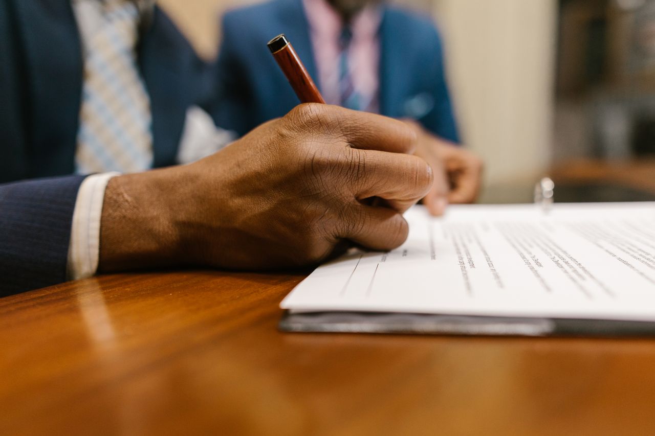 person signing an official legal document