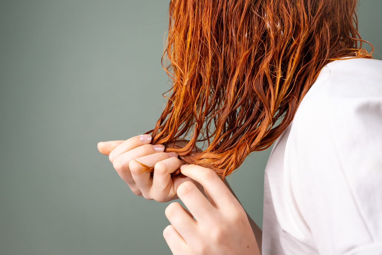 women applying a hair mask